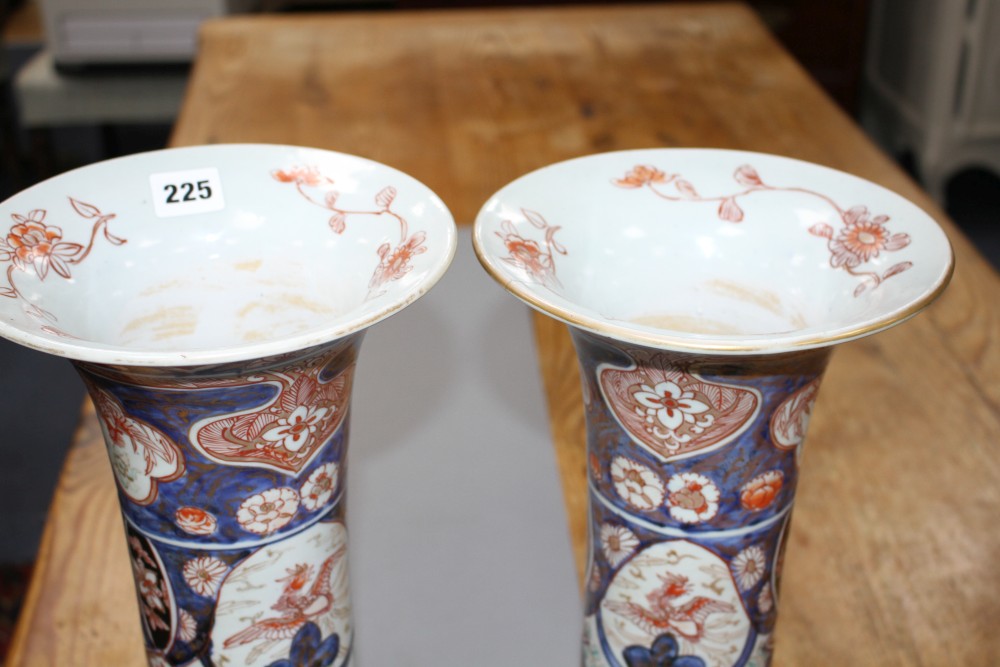 A near pair of Imari trumpet vases, decorated with birds and flowers, height 39.5cm